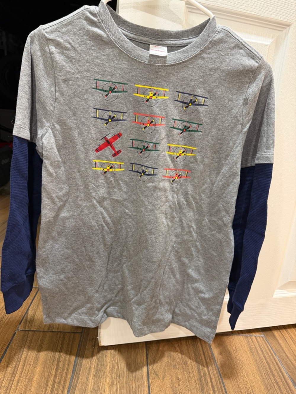 Hanna Andersson Grey Tee with Navy Sleeves and Colorful Plane Print